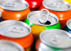 A close up of several cans of soda.